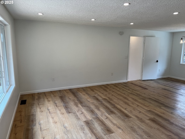 807 Glover St, Goldendale, WA 98620 - unfurnished room featuring wood finished floors, a textured ceiling, baseboards, and recessed lighting