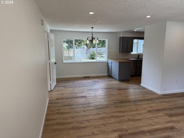 807 Glover St, Goldendale, WA 98620 - kitchen featuring a textured ceiling, a chandelier, baseboards, plenty of natural light, and recessed lighting