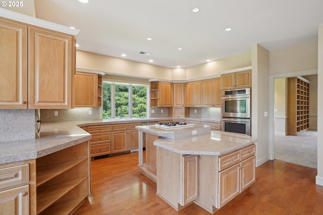 kitchen with light brown cabinetry, open shelves, stainless steel double oven, a center island, and white gas stovetop