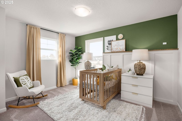 4321 Dogwood Ave SE, Albany, OR 97322 - bedroom featuring light carpet, a crib, and multiple windows