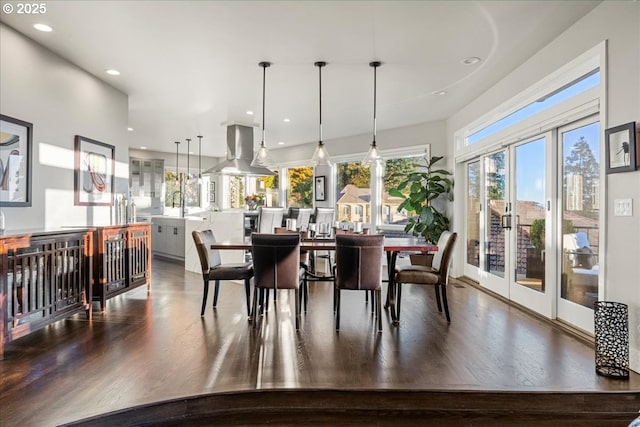 dining room with hardwood / wood-style flooring and sink