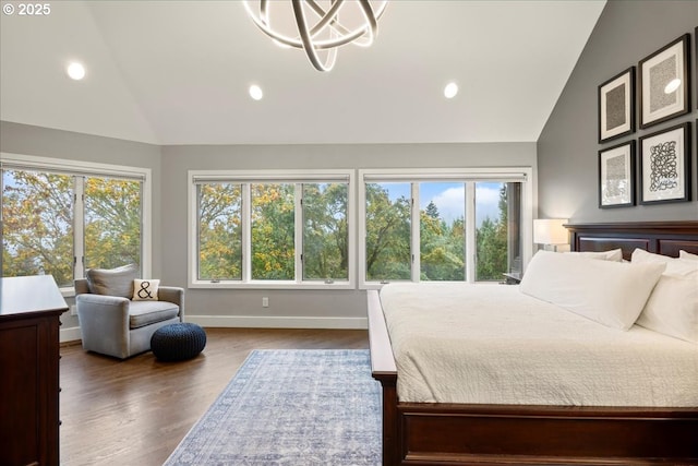 bedroom with lofted ceiling and dark hardwood / wood-style flooring