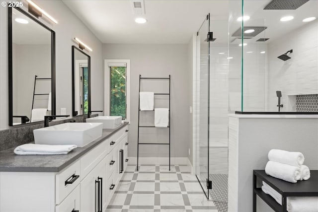 bathroom with vanity and a shower with shower door
