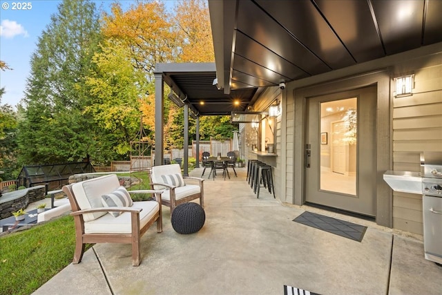 view of patio / terrace with a bar and an outdoor hangout area