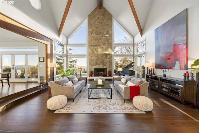 living room with hardwood / wood-style flooring, high vaulted ceiling, a fireplace, and french doors