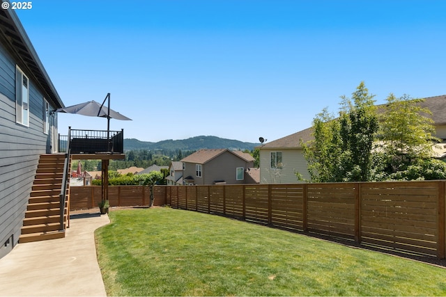 15708 SE Bybee Dr, Portland, OR 97236 - fenced backyard with stairs and a deck with mountain view