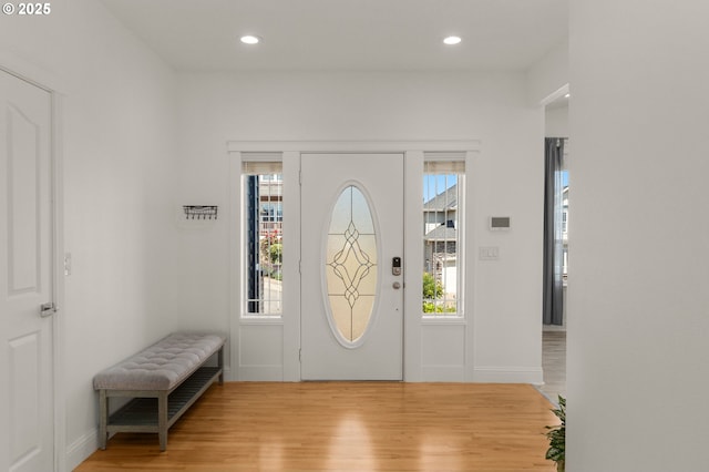 15708 SE Bybee Dr, Portland, OR 97236 - foyer entrance featuring light wood-type flooring, plenty of natural light, recessed lighting, and radiator heating unit