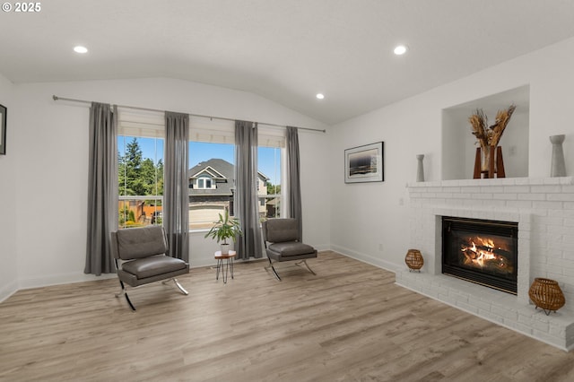 15708 SE Bybee Dr, Portland, OR 97236 - living area featuring vaulted ceiling, light wood-style flooring, a fireplace, and recessed lighting