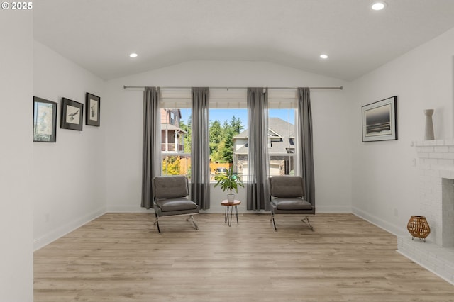 15708 SE Bybee Dr, Portland, OR 97236 - living area with vaulted ceiling, plenty of natural light, light wood finished floors, recessed lighting, and a fireplace