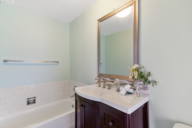 full bathroom featuring vanity and a bath