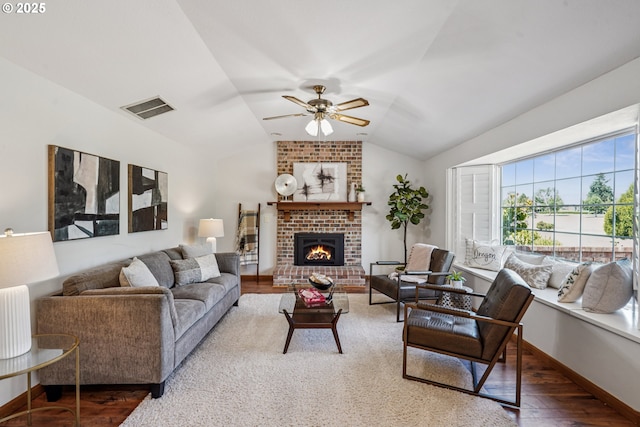 209 Mcnary Estates Dr N, Keizer, OR 97303 - living room with lofted ceiling, wood finished floors, a ceiling fan, and a fireplace