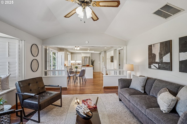 209 Mcnary Estates Dr N, Keizer, OR 97303 - living area featuring wood finished floors, lofted ceiling, and ceiling fan