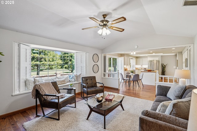 209 Mcnary Estates Dr N, Keizer, OR 97303 - living area featuring vaulted ceiling, wood finished floors, plenty of natural light, and ceiling fan