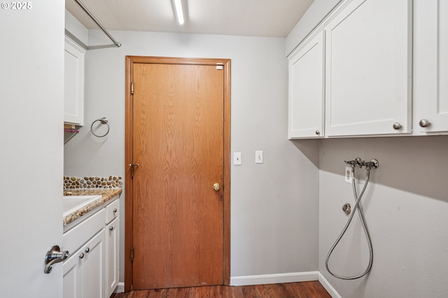 209 Mcnary Estates Dr N, Keizer, OR 97303 - washroom with wood finished floors, cabinet space, and washer hookup