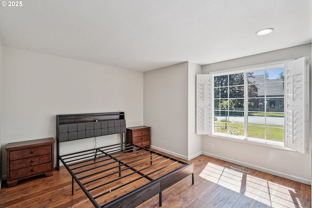 209 Mcnary Estates Dr N, Keizer, OR 97303 - unfurnished bedroom featuring baseboards and wood finished floors