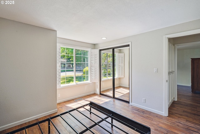209 Mcnary Estates Dr N, Keizer, OR 97303 - spare room featuring hardwood / wood-style flooring and a textured ceiling