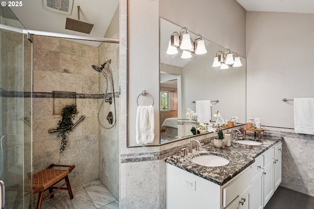 209 Mcnary Estates Dr N, Keizer, OR 97303 - ensuite bathroom featuring tiled shower, double vanity, and tile walls