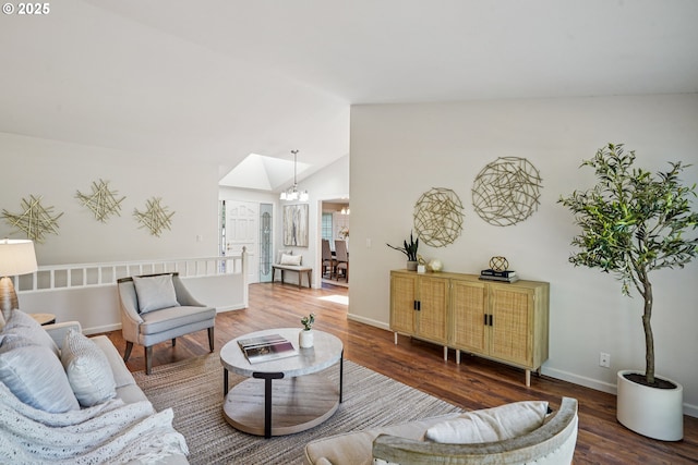 209 Mcnary Estates Dr N, Keizer, OR 97303 - living area featuring wood finished floors, vaulted ceiling, and a chandelier