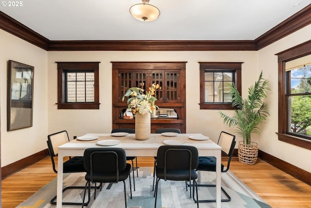 2522 NE 50th Ave, Portland, OR 97213 - dining room with baseboards, ornamental molding, and wood finished floors