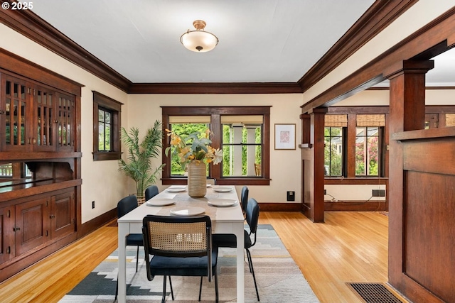 2522 NE 50th Ave, Portland, OR 97213 - dining area featuring healthy amount of natural light, light wood-type flooring, baseboards, and ornamental molding