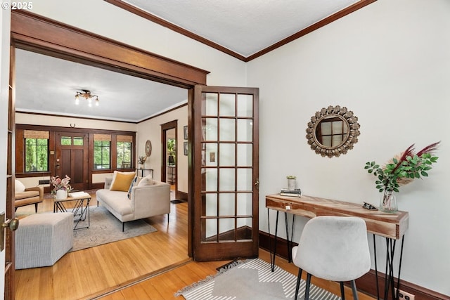 2522 NE 50th Ave, Portland, OR 97213 - living area with wood finished floors, ornamental molding, an office area, french doors, and baseboards