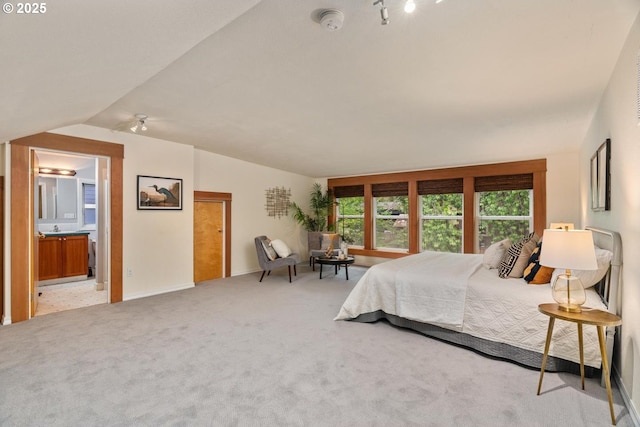 2522 NE 50th Ave, Portland, OR 97213 - bedroom with lofted ceiling, carpet, baseboards, and ensuite bath