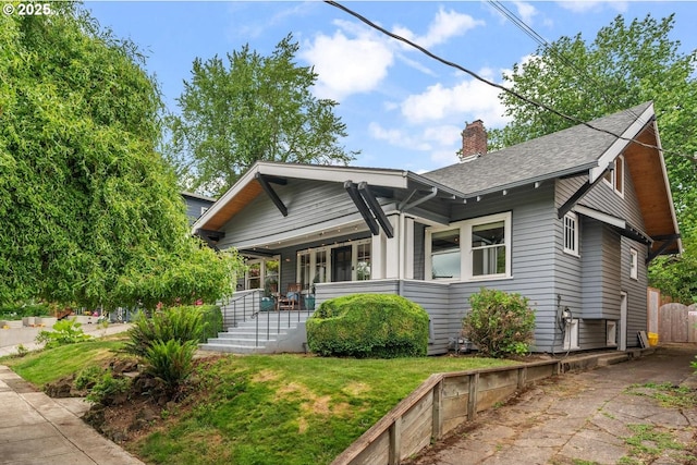 2522 NE 50th Ave, Portland, OR 97213 - bungalow with a porch, a chimney, a shingled roof, and a front yard