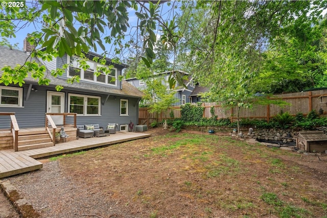 2522 NE 50th Ave, Portland, OR 97213 - back of property with a fenced backyard, a wooden deck, roof with shingles, outdoor lounge area, and a chimney