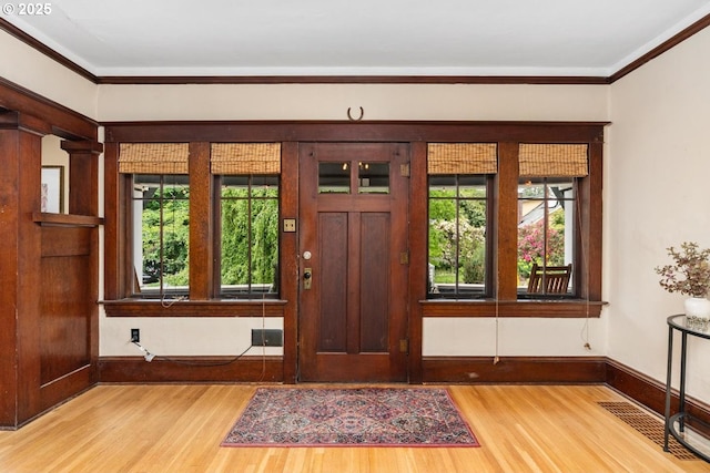 2522 NE 50th Ave, Portland, OR 97213 - foyer entrance featuring wood finished floors, baseboards, and ornamental molding