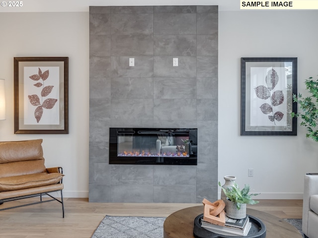 239 NW 29th Way, Battle Ground, WA 98604 - living area with baseboards, wood finished floors, and a tile fireplace
