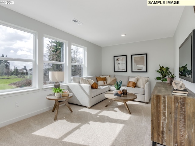 239 NW 29th Way, Battle Ground, WA 98604 - living area featuring baseboards, visible vents, carpet flooring, and a wealth of natural light