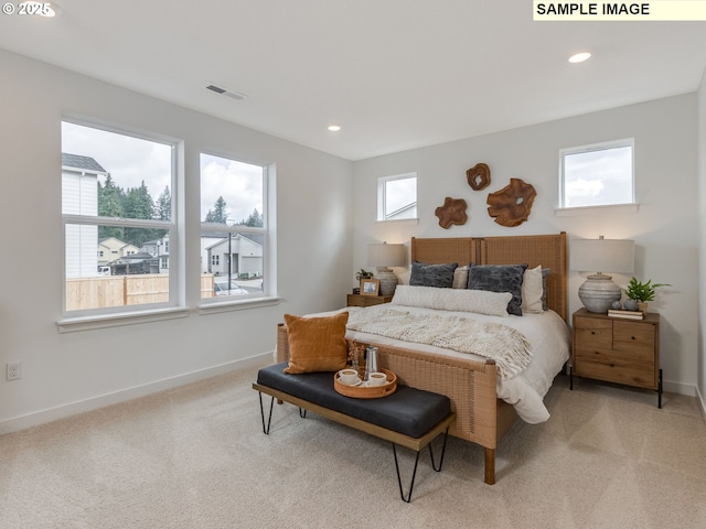 239 NW 29th Way, Battle Ground, WA 98604 - bedroom featuring baseboards, light carpet, and visible vents