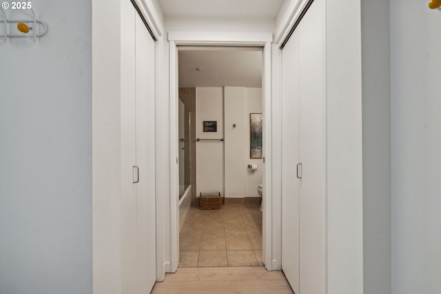 hall with light wood-type flooring