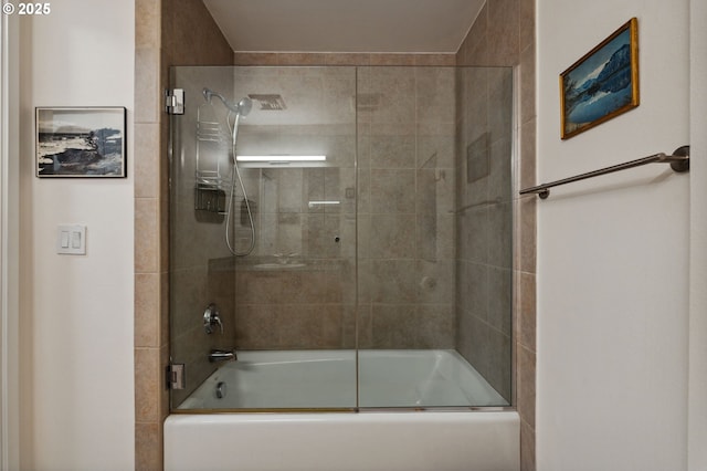 bathroom with shower / bath combination with glass door