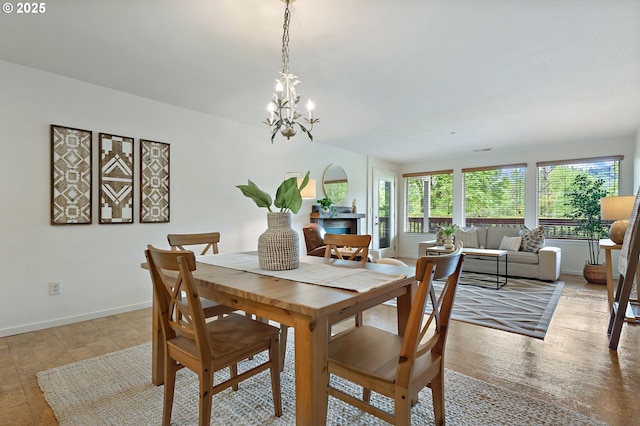 6708 N Richmond Ave, Portland, OR 97203 - dining room featuring baseboards and a chandelier