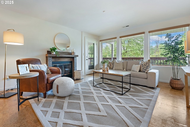 6708 N Richmond Ave, Portland, OR 97203 - living area featuring a premium fireplace, baseboards, and visible vents