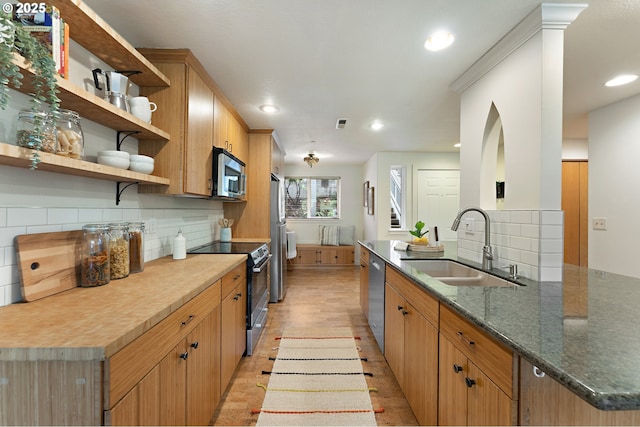 6708 N Richmond Ave, Portland, OR 97203 - kitchen featuring decorative backsplash, open shelves, a sink, stainless steel appliances, and recessed lighting