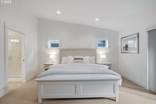 bedroom featuring light colored carpet, lofted ceiling, and multiple windows