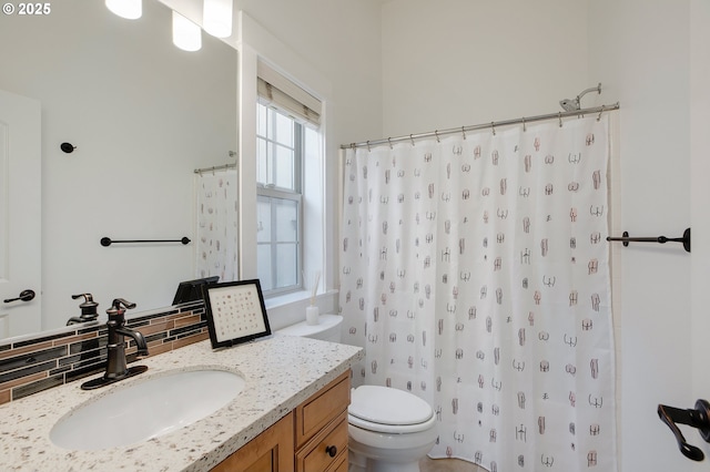 bathroom with vanity, toilet, backsplash, and a shower with shower curtain