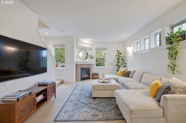 living room featuring a fireplace and light colored carpet