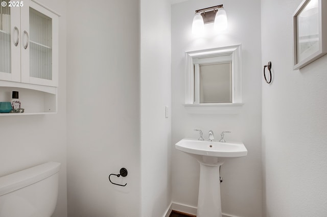 bathroom featuring toilet