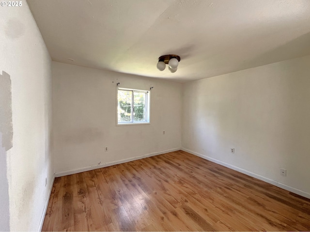 1042 Fir Ave, Reedsport, OR 97467 - unfurnished room featuring light wood-type flooring and baseboards