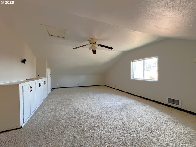 1042 Fir Ave, Reedsport, OR 97467 - bonus room featuring lofted ceiling, carpet, and ceiling fan