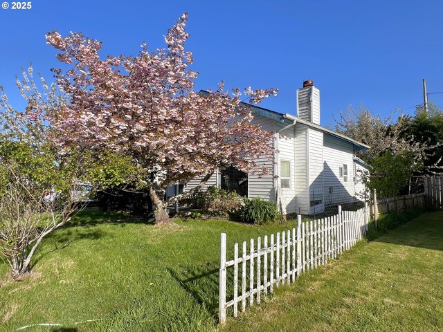 1042 Fir Ave, Reedsport, OR 97467 - view of side of home with a chimney