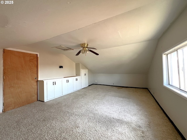 1042 Fir Ave, Reedsport, OR 97467 - additional living space with vaulted ceiling, light colored carpet, and a ceiling fan