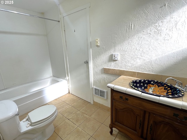 1042 Fir Ave, Reedsport, OR 97467 - full bathroom featuring vanity, a textured wall, tile patterned flooring, and shower / tub combination