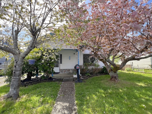 1042 Fir Ave, Reedsport, OR 97467 - view of property hidden behind natural elements with a porch