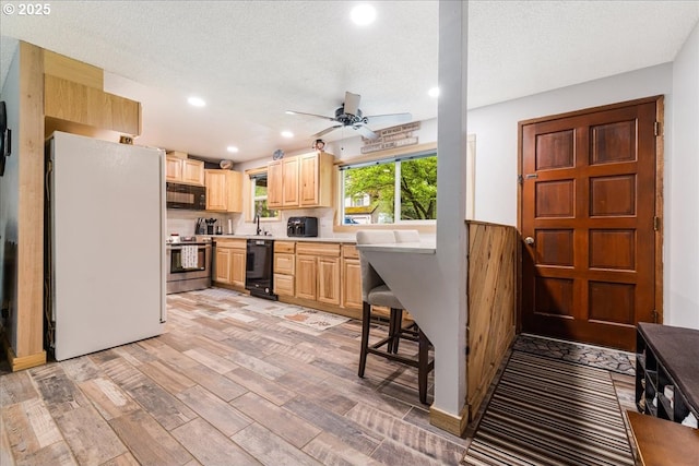 22260 E Wild Fern Ln, Brightwood, OR 97011 - kitchen with black appliances, light brown cabinets, recessed lighting, ceiling fan, and light countertops