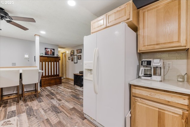 22260 E Wild Fern Ln, Brightwood, OR 97011 - kitchen with white fridge with ice dispenser, light brown cabinetry, a ceiling fan, tasteful backsplash, and recessed lighting