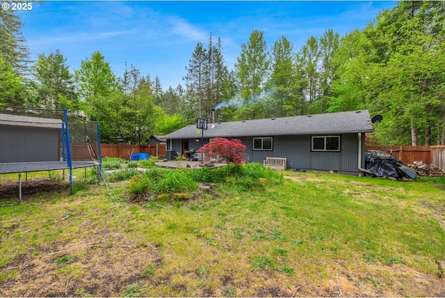22260 E Wild Fern Ln, Brightwood, OR 97011 - rear view of house featuring a trampoline and a patio area